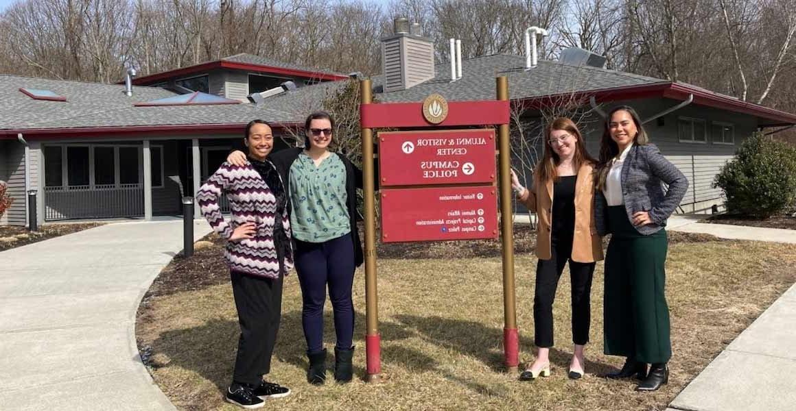 Alumni Relations staff members outside the Alumni & Visitor Center